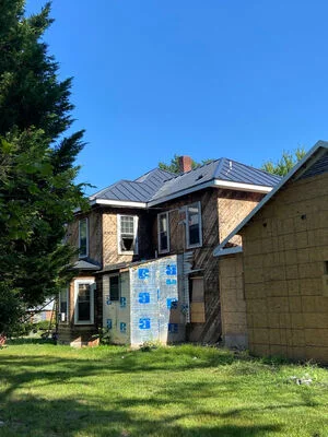 Metal roofing installed over a porch addition