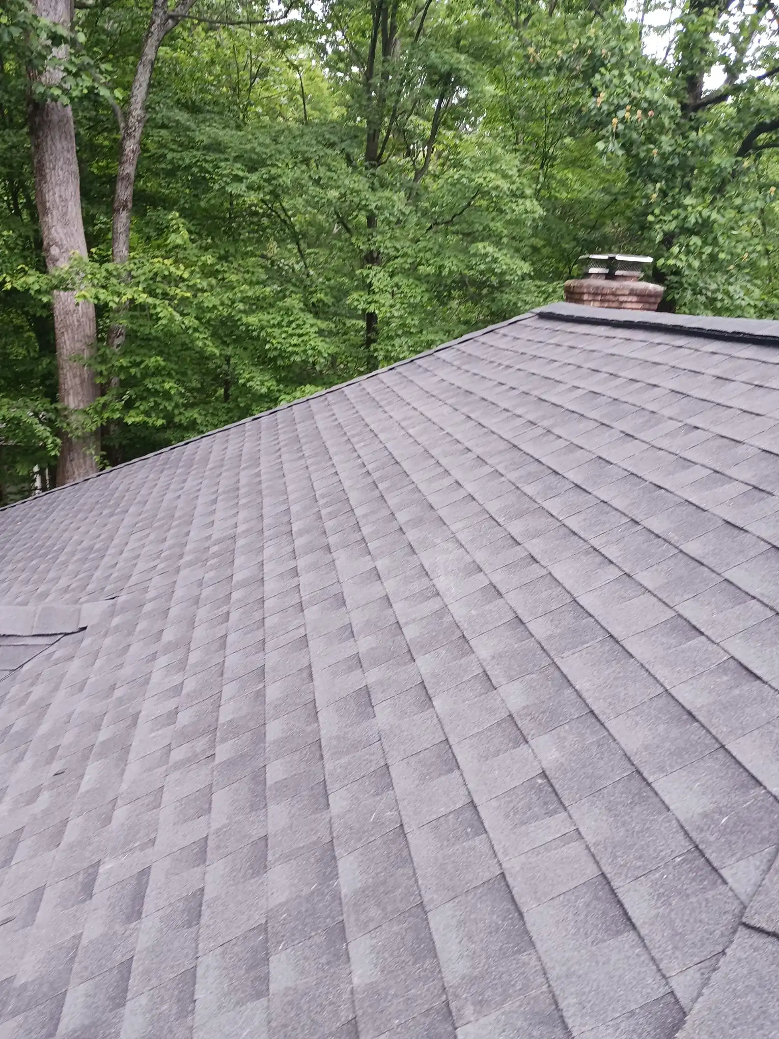 Completed shingle replacement with valley detail