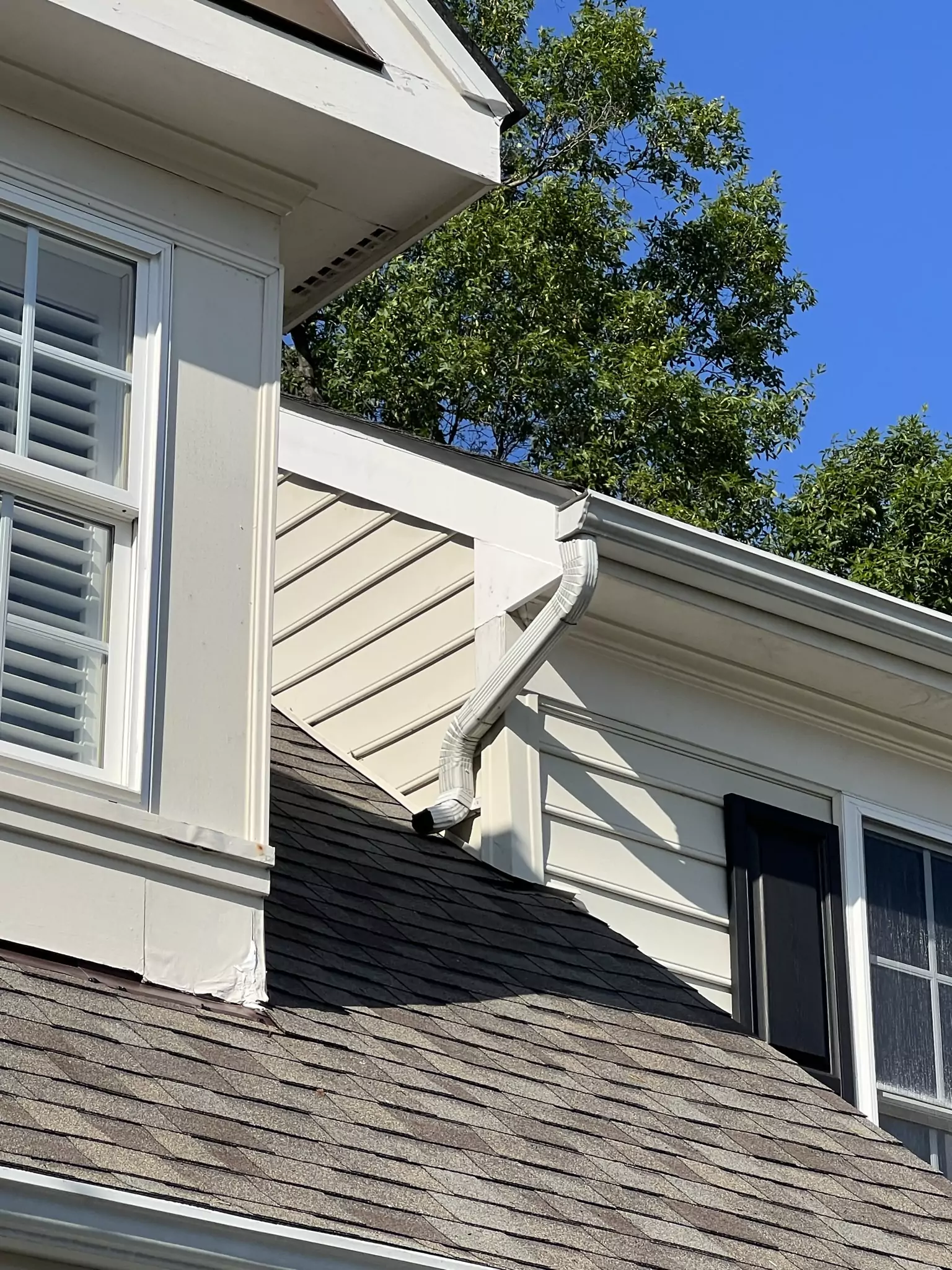 Architectural shingle roof with dormer transitions